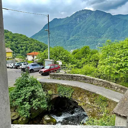 A House Between A Waterfall And A The Enchantment Of Nesso