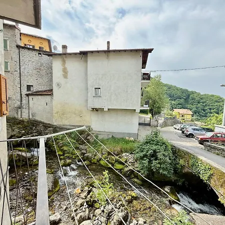 A House Between A Waterfall And A The Enchantment Of