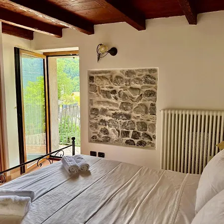 A House Between A Waterfall And A The Enchantment Of Nesso