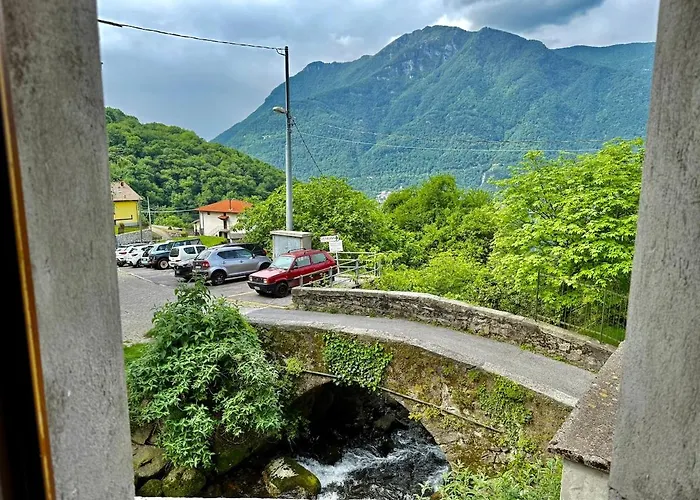A House Between A Waterfall And A The Enchantment Of Nesso