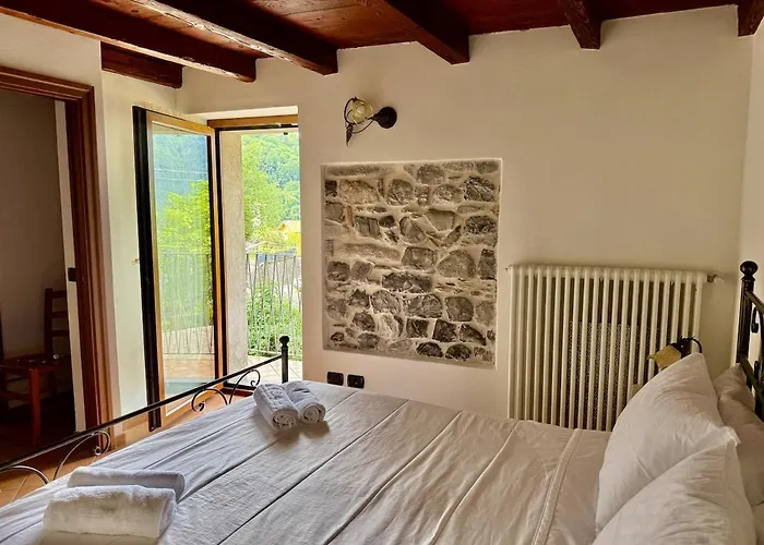 A House Between A Waterfall And A The Enchantment Of Nesso